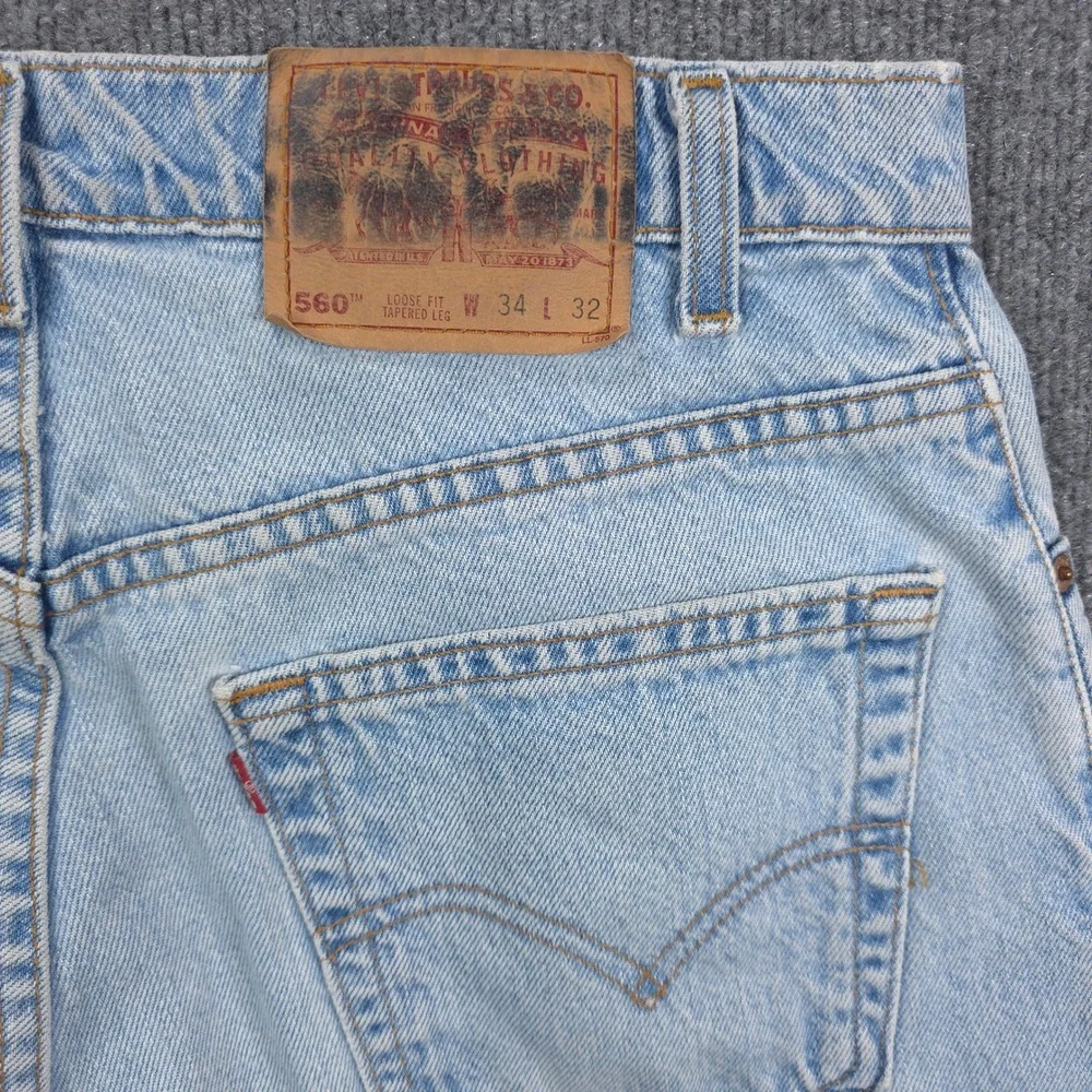 VINTAGE Levis 560 Loose Fit Tapered Leg Jeans Light Wash Blue Mens Denim 34x32
